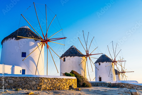 Famous Mykonos town windmills in a romantic sunset, Mykonos island, Cyclades, Greece