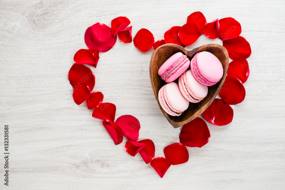 heart of rose petals and makaroon, copy space for text, top view heart of rose petals and makaroon, copy space for text, top view