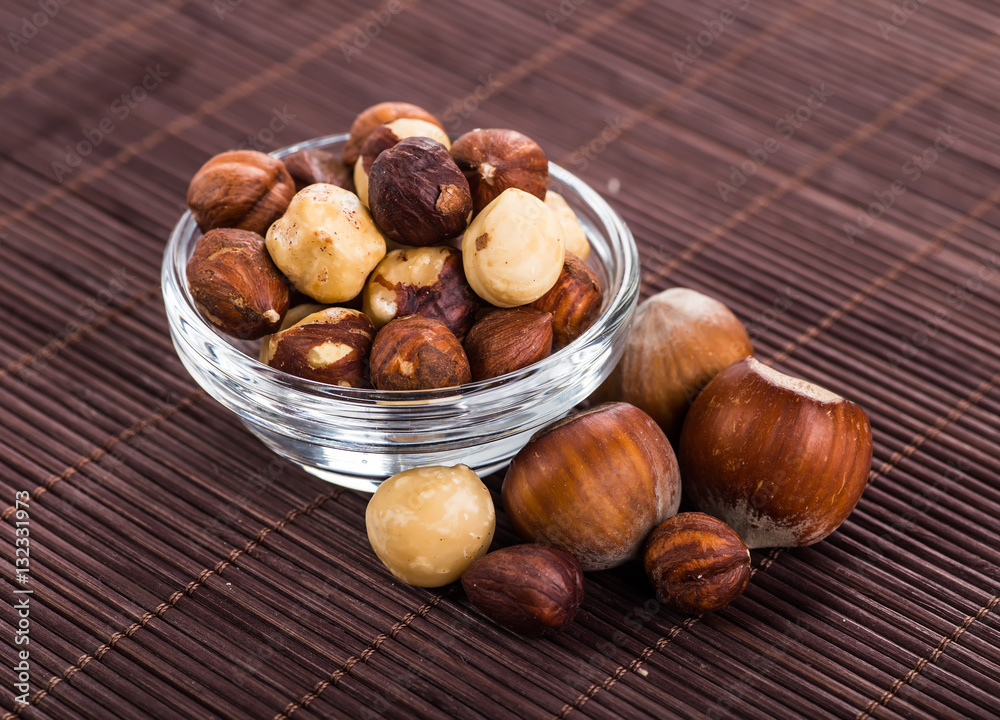 Obraz premium Nuts mix in a wooden plate