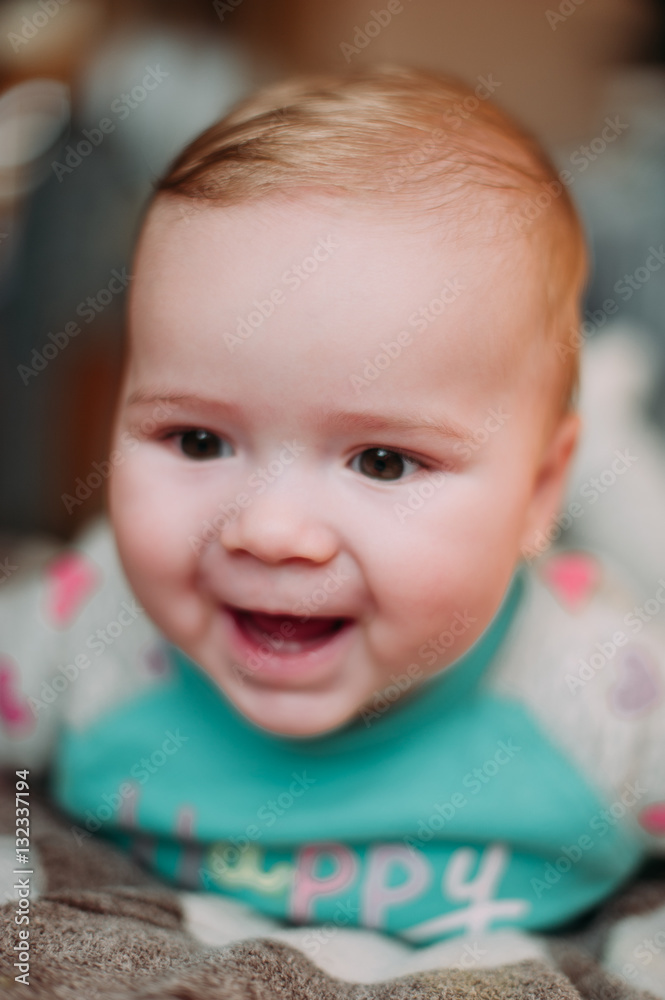 little cute baby toddler on carpet close up smiling adorable happy emotional playing at home