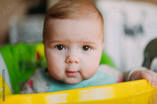 little cute baby toddler on carpet close up smiling adorable happy emotional playing at home