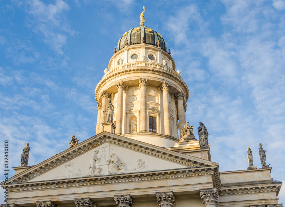 View on German Cathedral at Gendarmenmarkt square on a crips winter day with soft clouds, Berlin, Germany