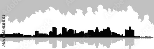 Wide skyline silhouette of the downtown of the city of Detroit, Michigan, USA.