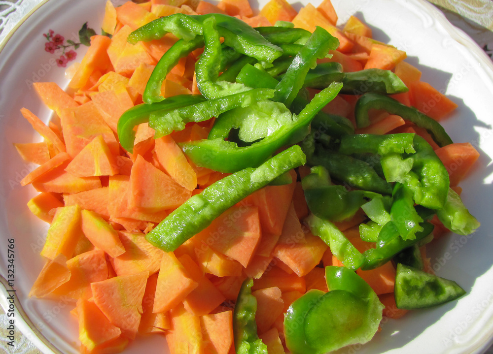 Chopped vegetables: carrots and green peppers Chopped vegetables: carrots and green peppers