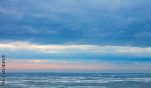 ship sails on the frozen sea, winter, north. nature background