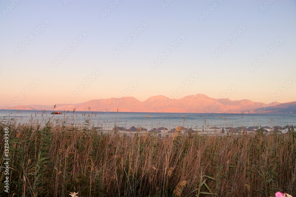 VIEW ON THE BAY OF MIRABELLO NEAR AGIOS NIKOLAOS, AT SUNSET  CRETE 
GREECE

