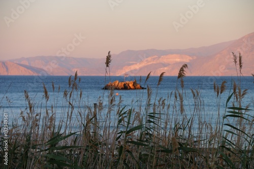 VIEW ON THE BAY OF MIRABELLO NEAR AGIOS NIKOLAOS, AT SUNSET  CRETE 
GREECE

