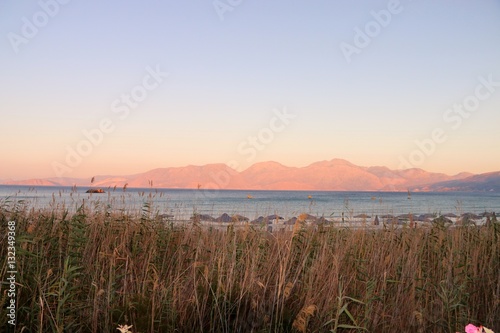 VIEW ON THE BAY OF MIRABELLO NEAR AGIOS NIKOLAOS, AT SUNSET  CRETE 
GREECE


