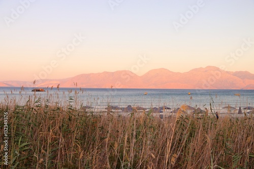 VIEW ON THE BAY OF MIRABELLO NEAR AGIOS NIKOLAOS, AT SUNSET CRETE GREECE