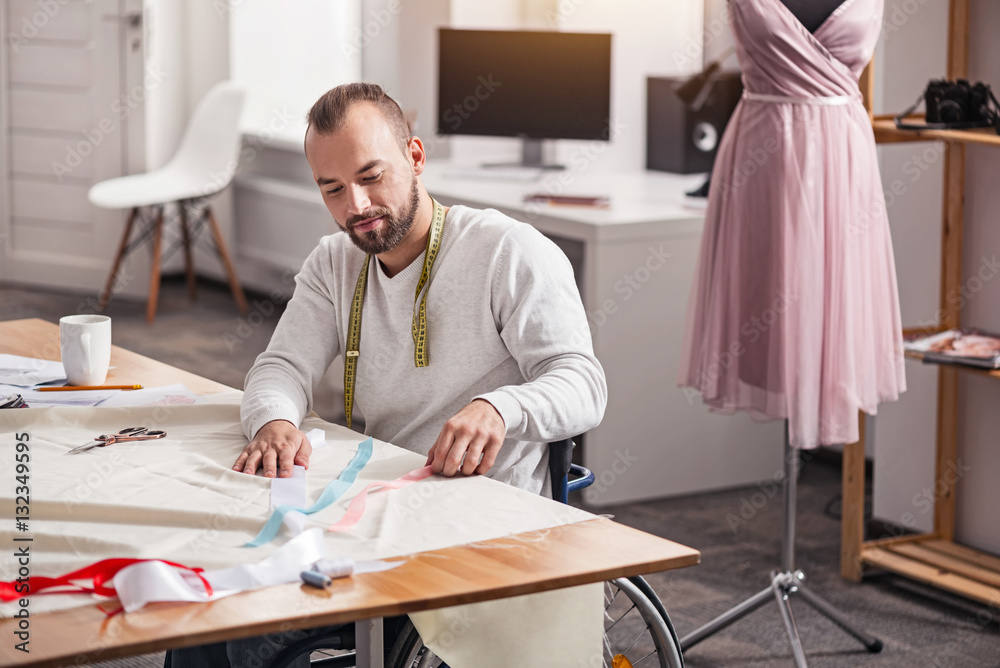 Determined young designer deciding on color scheme Determined young designer deciding on color scheme