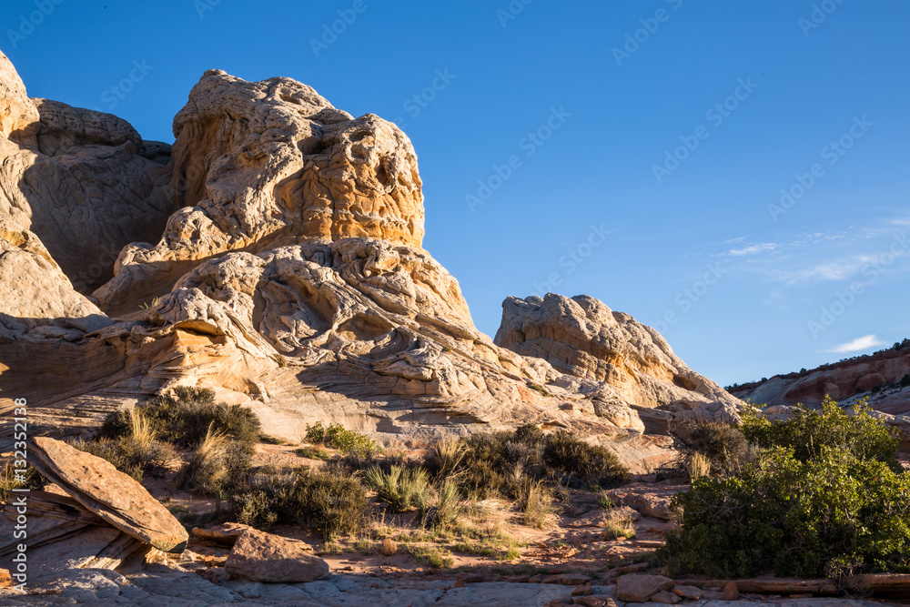 Fototapeta premium White and orange sandstone tower at sunrise