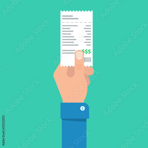 Man's hand holds the account or bill for payment