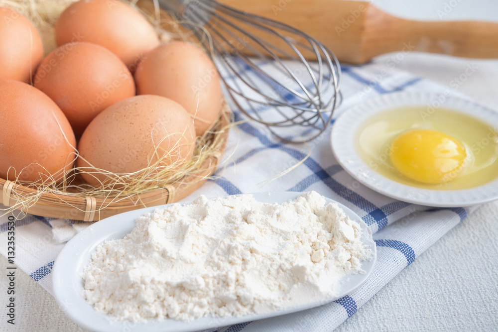 Eggs and flour ingredients like baking, culinary background Eggs and flour ingredients like baking, culinary background