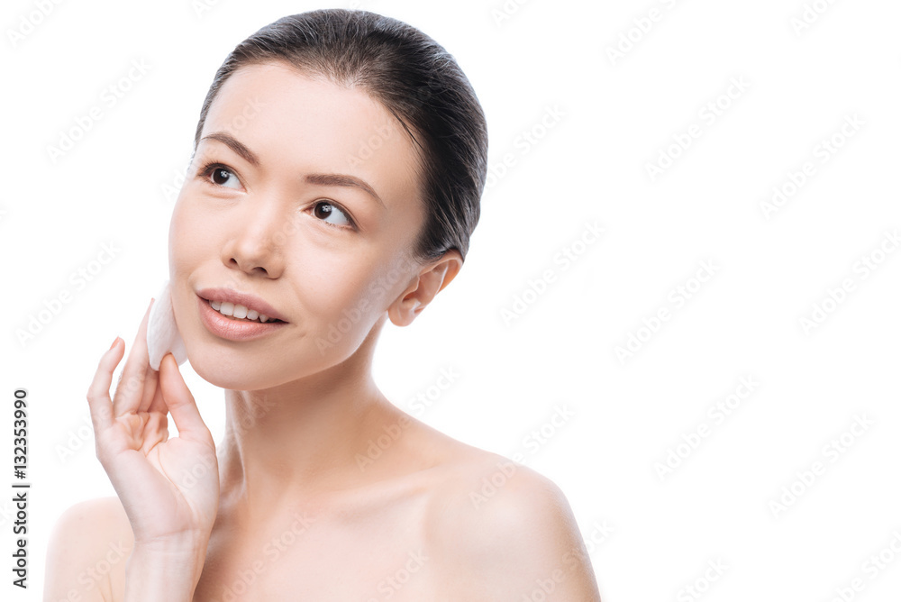 Attractive nice woman holding a cotton disc Attractive nice woman holding a cotton disc