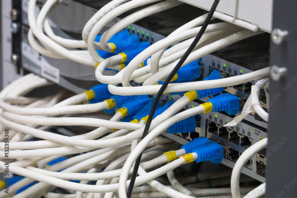 Network switch HUB and ethernet cables (LAN) in datacenter Network switch HUB and ethernet cables (LAN) in datacenter