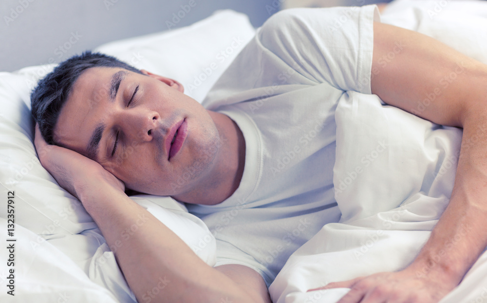 handsome man sleeping in bed handsome man sleeping in bed