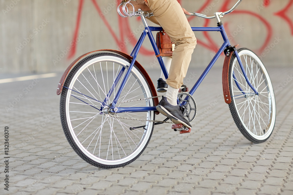 close up of hipster man riding fixed gear bike close up of hipster man riding fixed gear bike