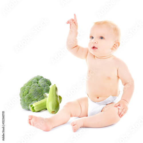 Cute baby with vegetables o...