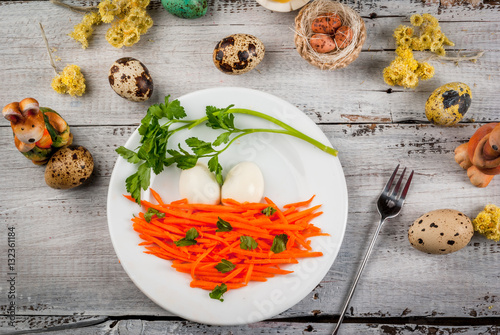 Idea for the children's lunch on Easter: a salad of fresh carrots with parsley and eggs, decorated in the form of a bird's nest