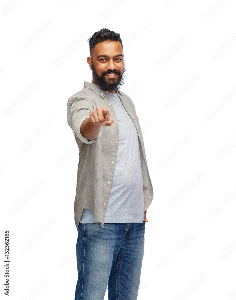 happy smiling indian man pointing finger to you happy smiling indian man pointing finger to you