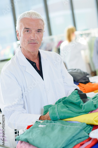 Senior man sorting laundry