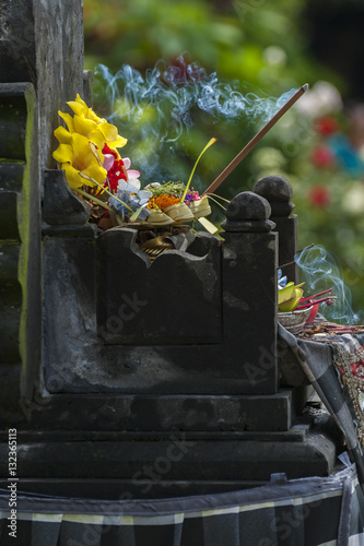 Balinese Hindu Offerings Called Canang. Canang sari is one of the daily offerings made by Balinese Hindus to thank the Sang Hyang Widhi Wasa in praise and prayer and can be seen everywhere in Bali. photo