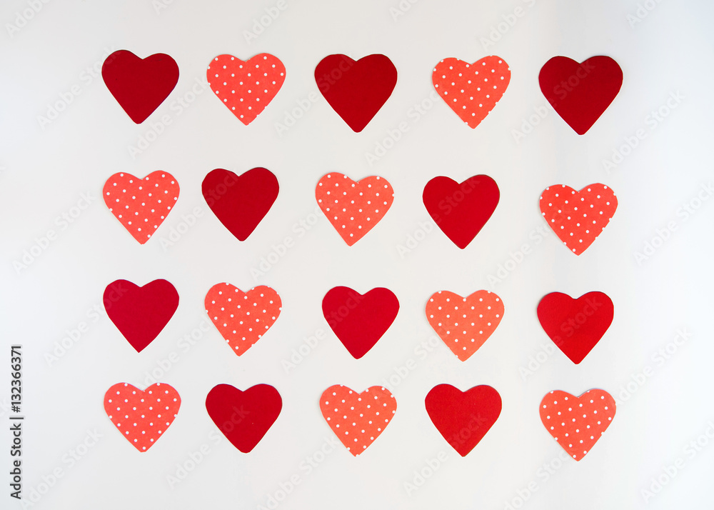 Valentines day background, red and pink hearts on a white background, pattern of hearts