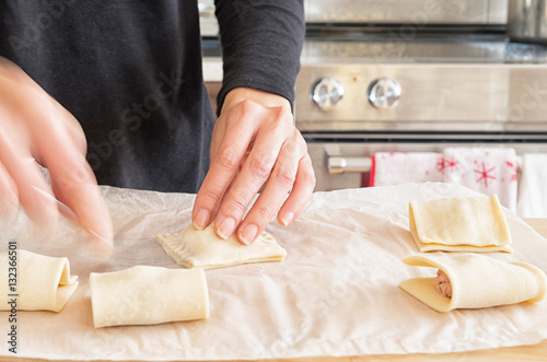 Woman preparing Vietnamese style Pate Chaud in a kitchen