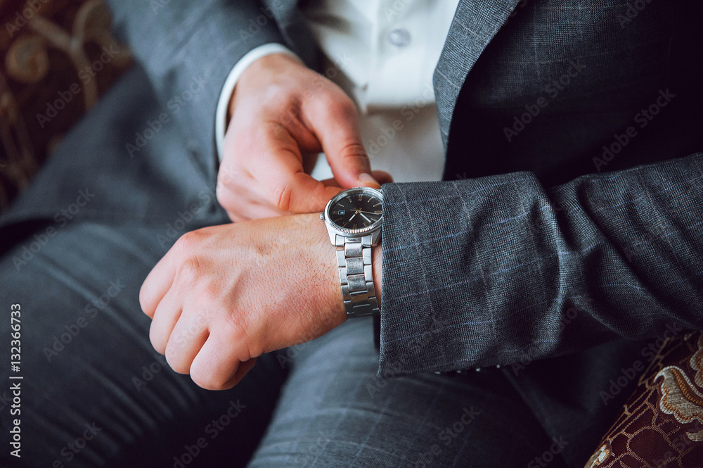 watch dressed in the man's hand watch dressed in the man's hand