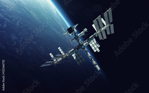 Fototapeta Naklejka Na Ścianę i Meble -  International Space Station over the planet Earth. Elements of this image furnished by NASA