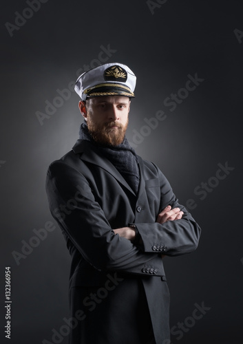 Fotografie Portrait of a handsome sailor on a dark background