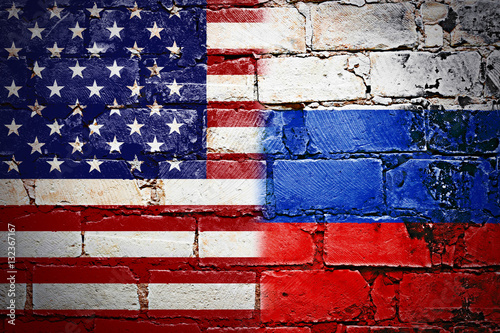 Governments conflict concept. Brick wall colored in USA and Russian flags