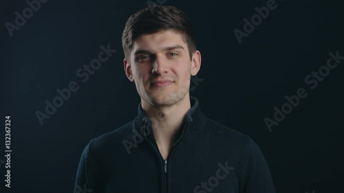 gesture and happiness concept - handsome man showing ok-sign