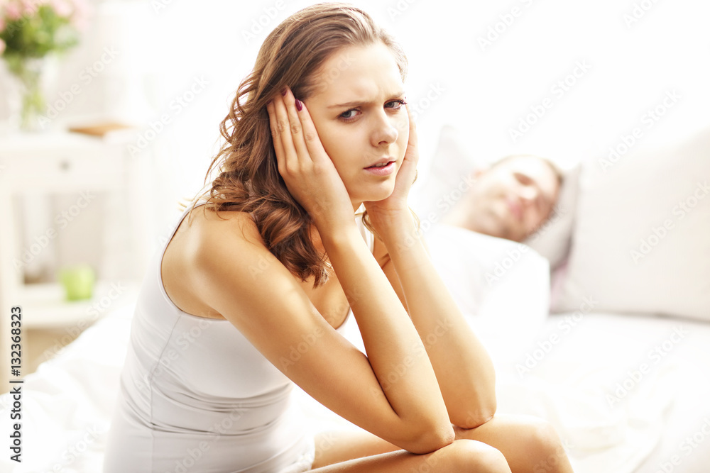 Young woman and her man having problem in bedroom Young woman and her man having problem in bedroom