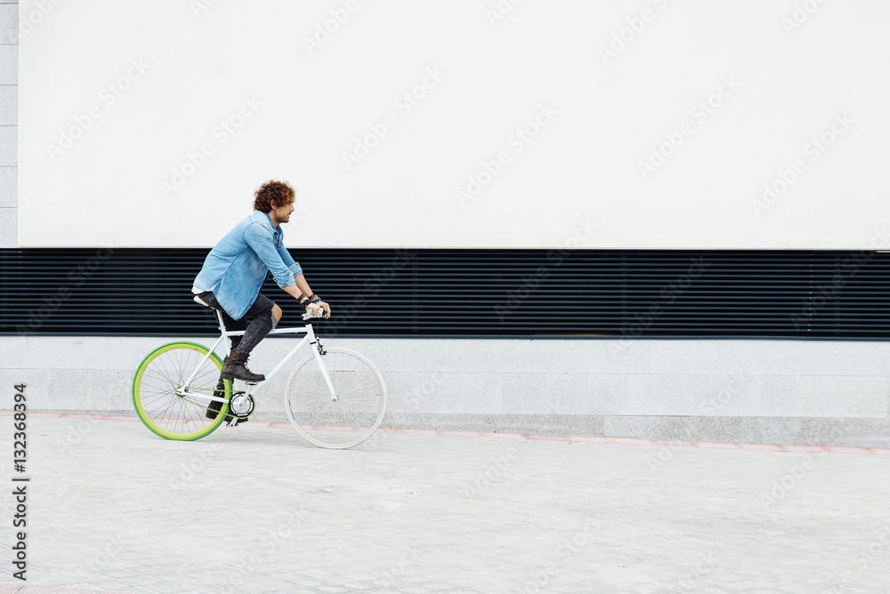 Handsome young man with fixed gear bicycle. Handsome young man with fixed gear bicycle.