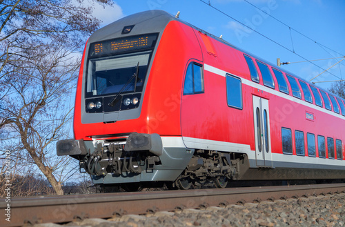 german passenger train drives to the next station