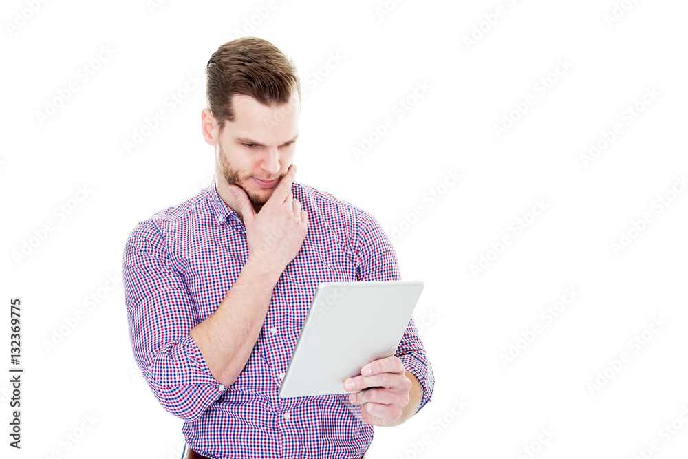Businessman looking at tablet computer and thinking - isolated o Businessman looking at tablet computer and thinking - isolated o