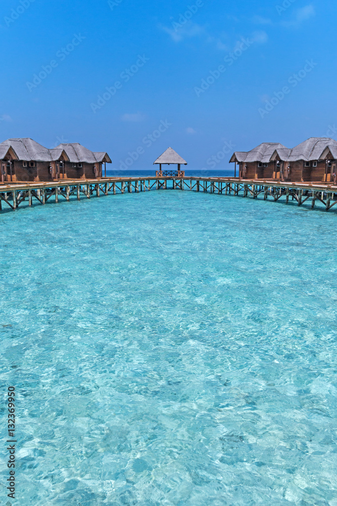 Beautiful tropical Maldives resort hotel with beach and blue water for relax. 
