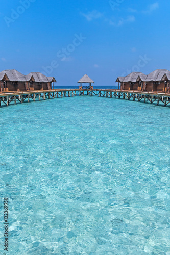 Fototapeta Naklejka Na Ścianę i Meble -  Beautiful tropical Maldives resort hotel with beach and blue water for relax. 