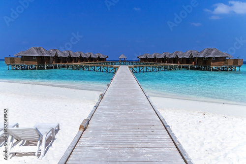 Beautiful tropical Maldives resort hotel with beach and blue water for relax.