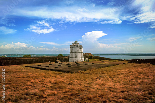 Portuguese fort Aguada. Goa, Candolim. India. Ancient fort and lighthouse built in the 17th century at Goa. photo