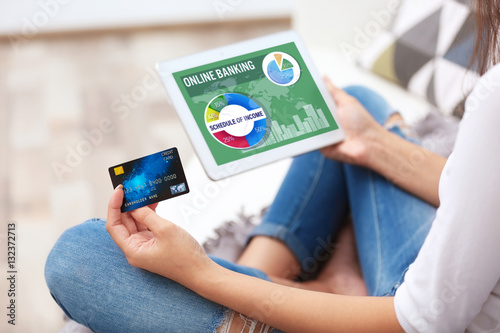 Online banking concept. Woman using tablet and credit card