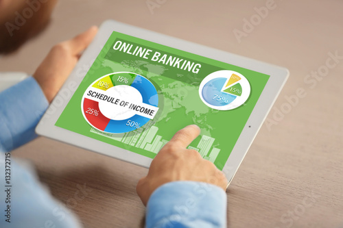 Online banking concept. Man using tablet