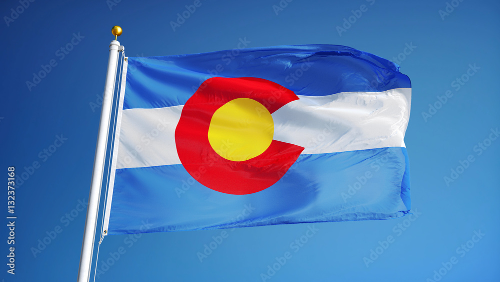 Naklejka premium Colorado (U.S. state) flag waving against clear blue sky, close up, isolated with clipping path mask alpha channel transparency, perfect for film, news, composition