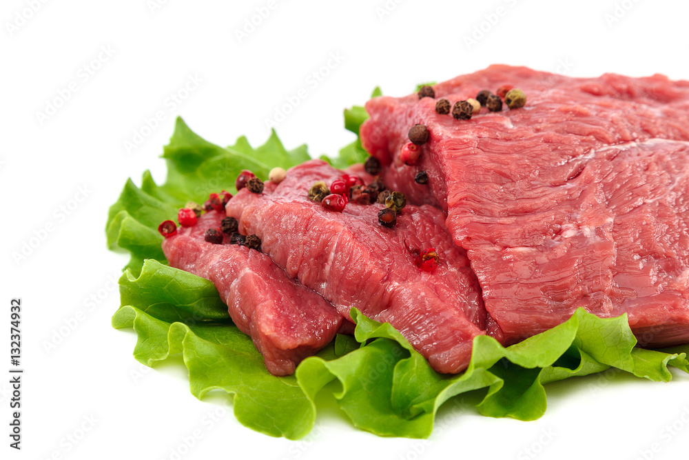 Meat on a cutting board and spices on white background. Meat on a cutting board and spices on white background.