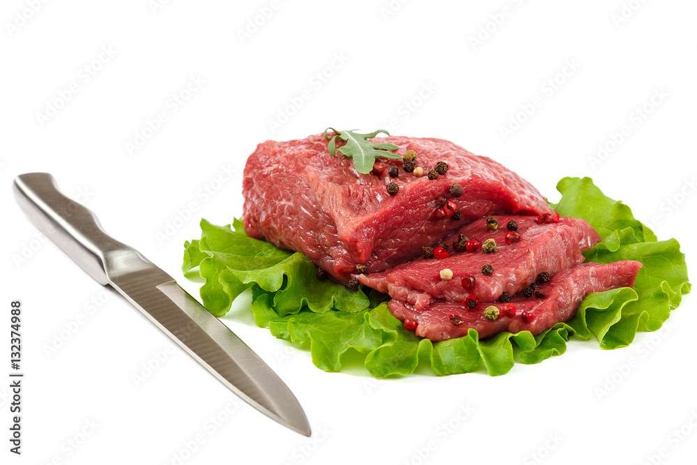 Meat with a knife and spices on white background Meat with a knife and spices on white background