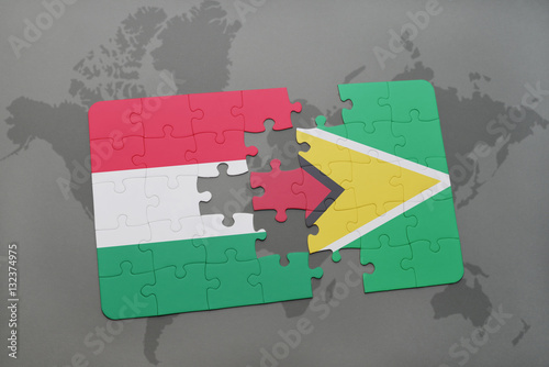 puzzle with the national flag of hungary and guyana on a world map