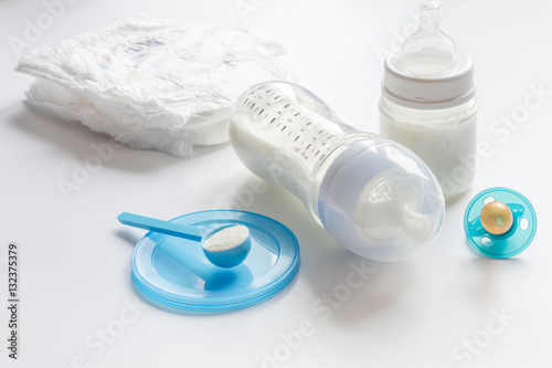 preparation of mixture baby feeding on white background