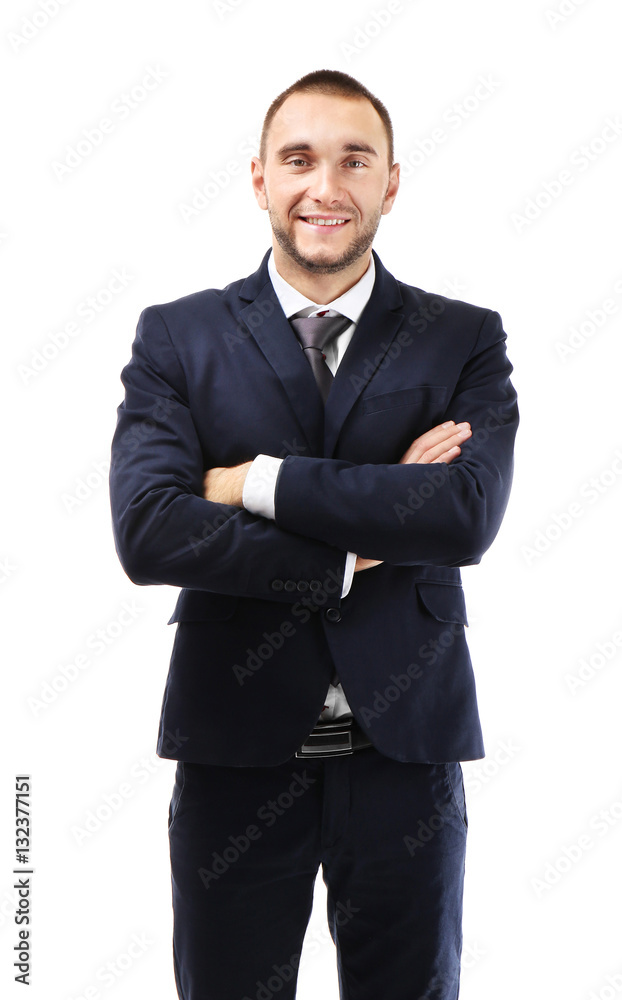 Young business coach with crossed hands standing on white background