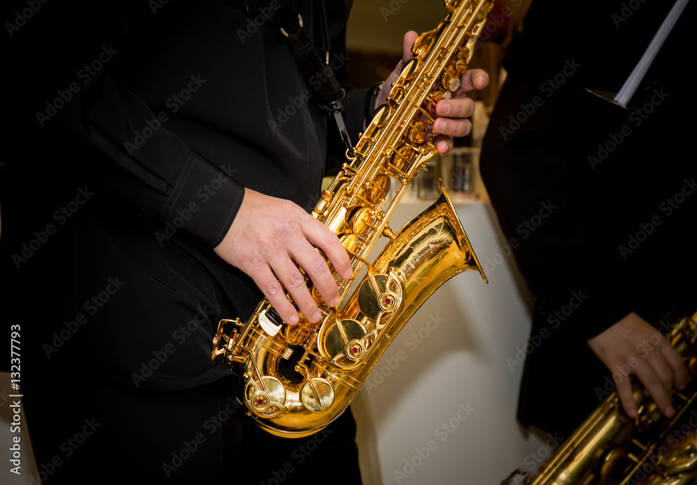 Fototapeta premium saxophone player palys his solo
